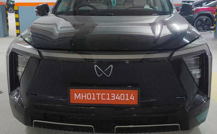 A full-width LED light bar at the front